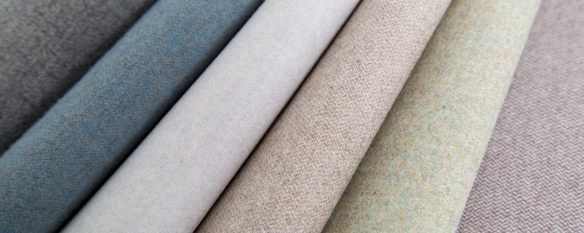 Fabric wallpaper – close-up rolls of woven textile wallcoverings