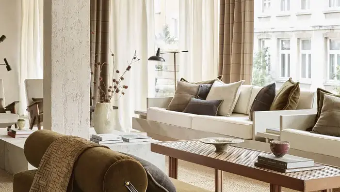 Designer wool curtains, upholstery and cushions in a contemporary neutral interior