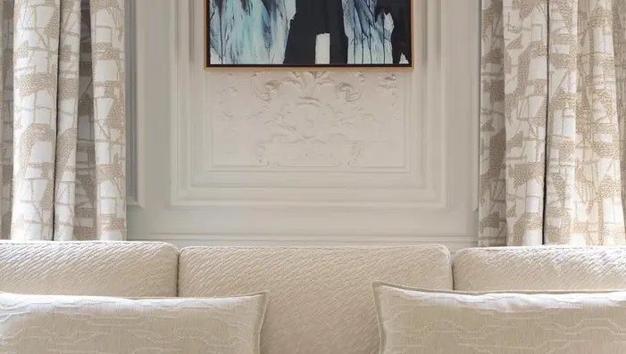 Cream bouclé sofa in a softly styled contemporary living room