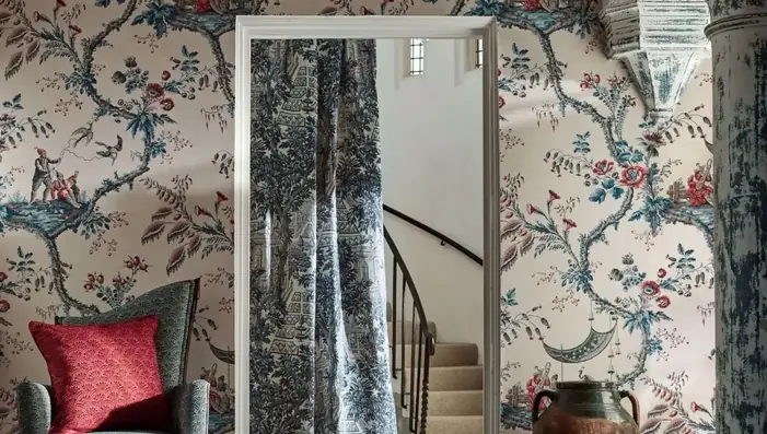 Expressive toile patterned wallpaper in a hallway interior setting