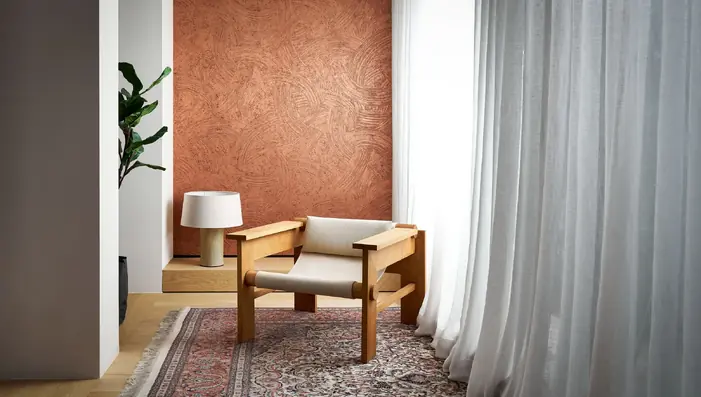 Copper metallic foil wallpaper with a textured painted effect in a contemporary interior