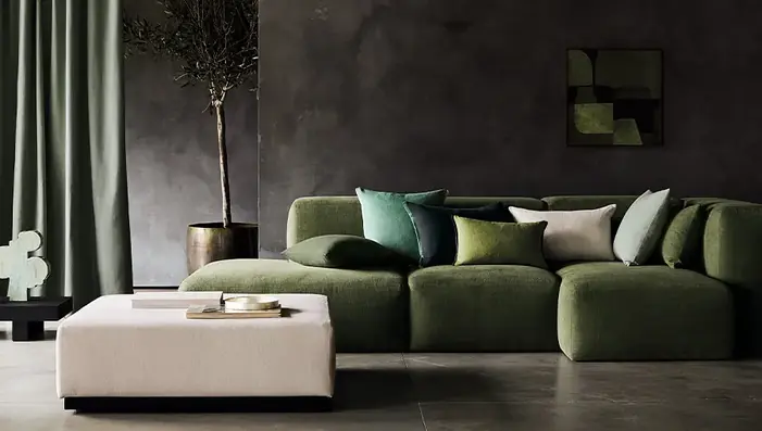 Designer fabrics used for curtains, sofa upholstery and cushions in a contemporary interior
