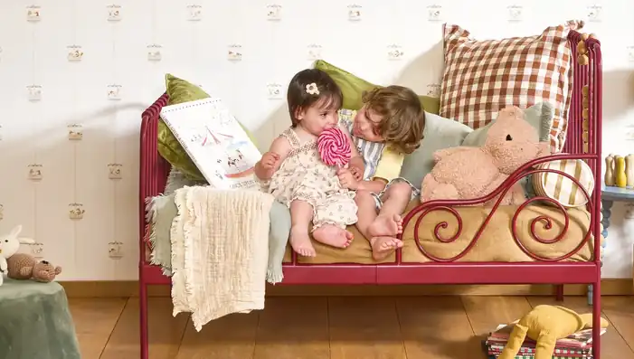 Children’s bedroom with playful carousel wallpaper and colourful furniture