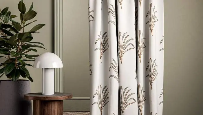 Clarke and Clarke Cassia fabric with botanical embroidery, palms, leaves and tactile woven textures