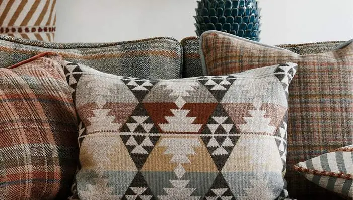 Osborne and Little Rannoch Wools fabrics featuring Scottish-inspired checks, geometric patterns and textured wool weaves