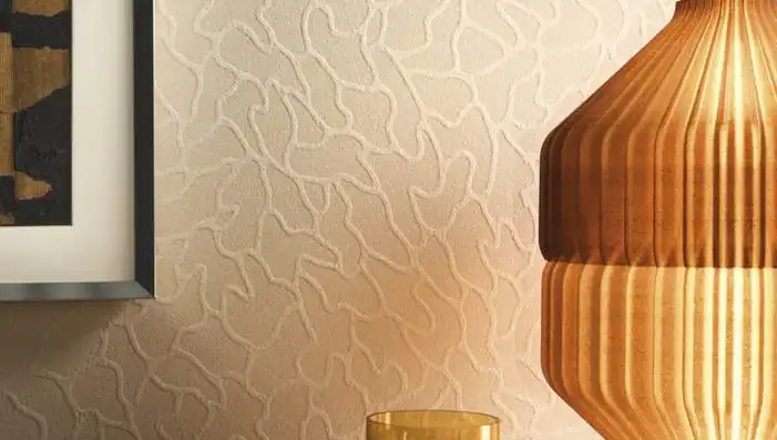 Omexco Whisper wallpaper featuring mineral-inspired patterns, mica grain, marble and pearlescent textures