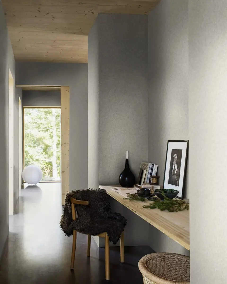 Boråstapeter Northern Stone wallpaper in a calm grey hallway study nook