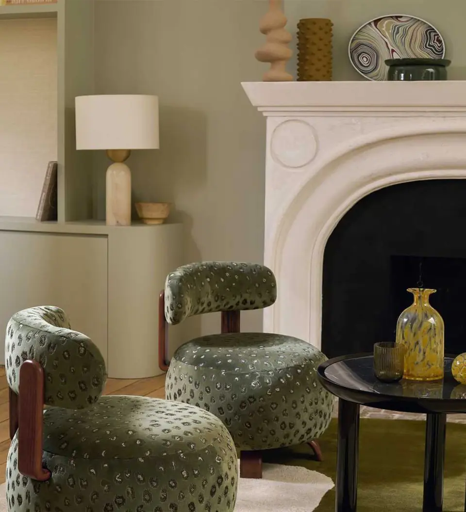 Daim subtle animal print upholstery fabric by Casamance on an armchair