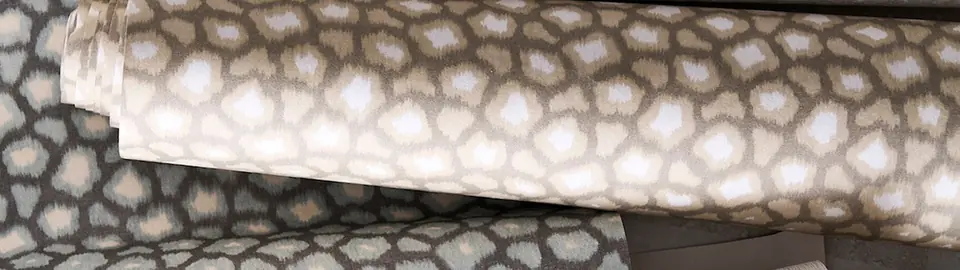 Loam abstract animal-inspired wallpaper by Harlequin behind a modern sofa