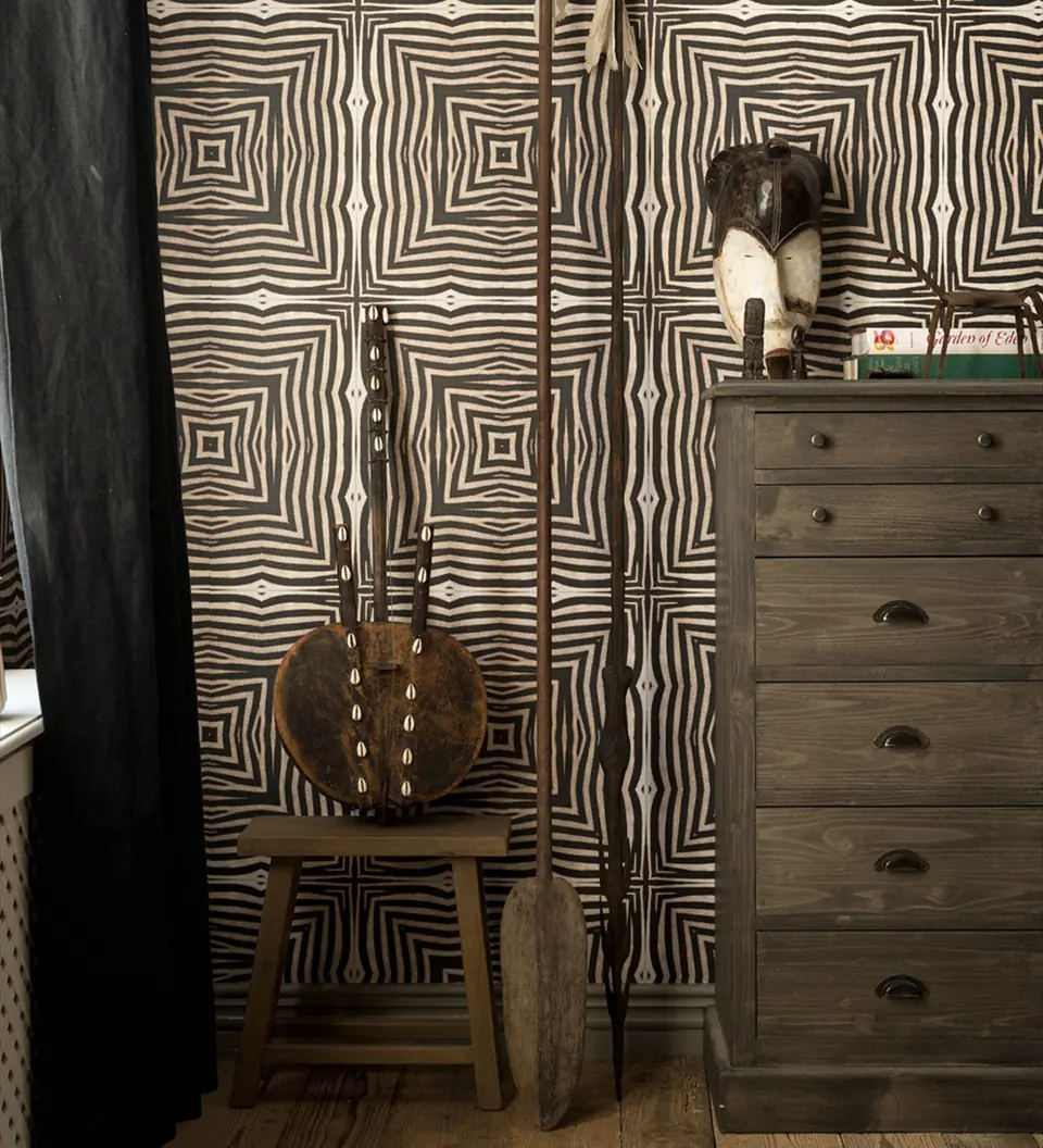 Serengeti animal print wallpaper by Mind The Gap in a styled living room