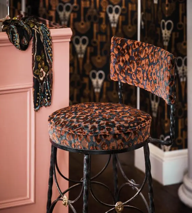 Trixie animal print curtain fabric by Romo framing a large window