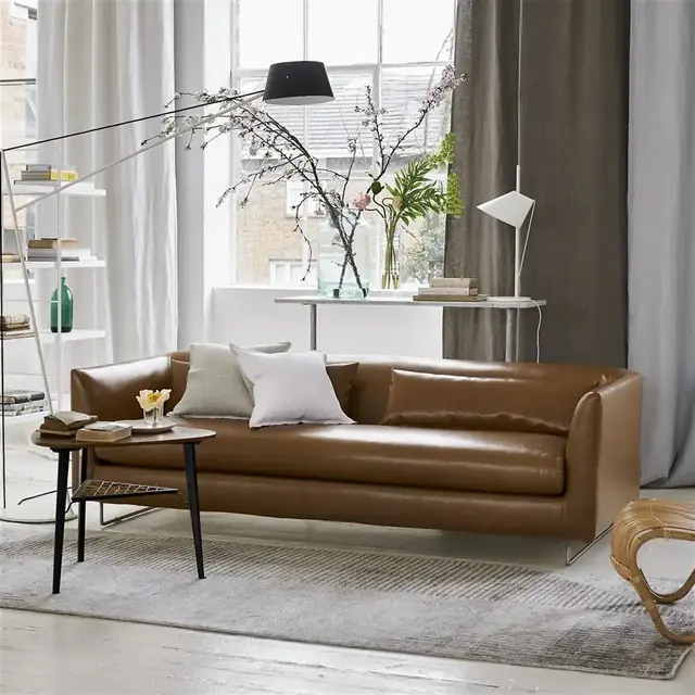 Brown faux leather sofa in a contemporary living room