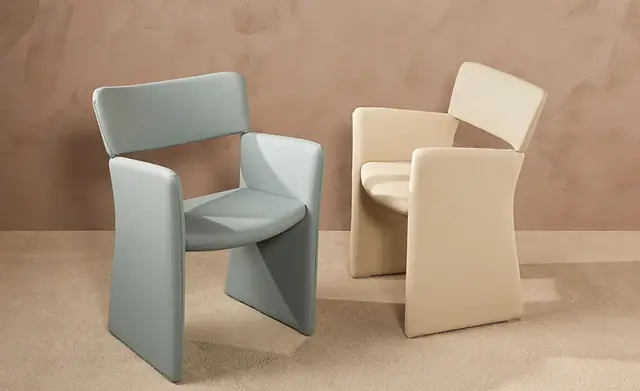 Contemporary chairs upholstered in pale blue and cream faux leather