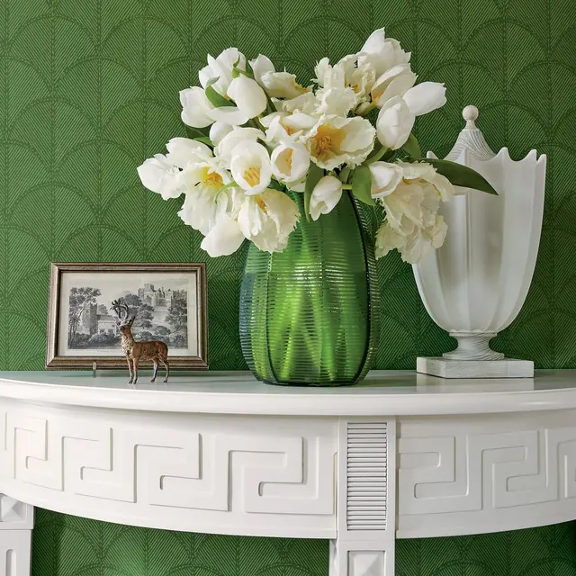Anna French Seton Scallop green Art Deco wallpaper with elegant decorative accessories