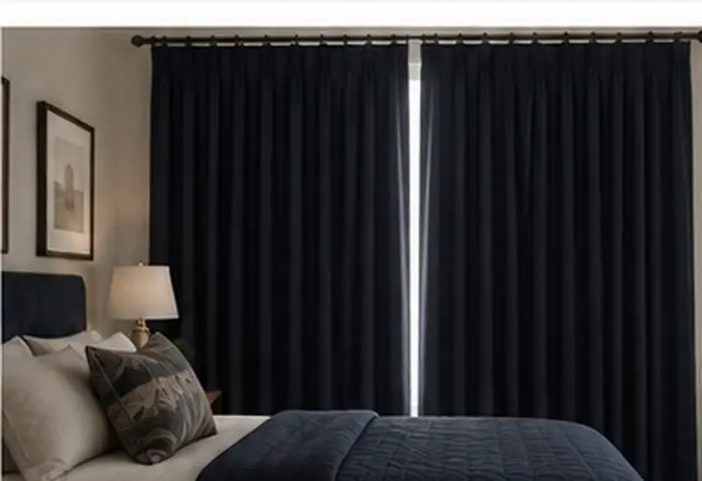 Dark bedroom with full-length blackout curtains at the window
