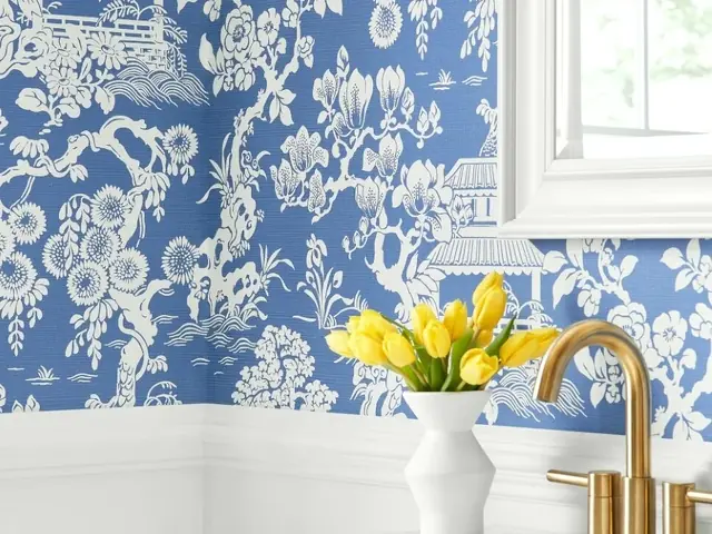 Blue floral designer wallpaper in an elegant bathroom