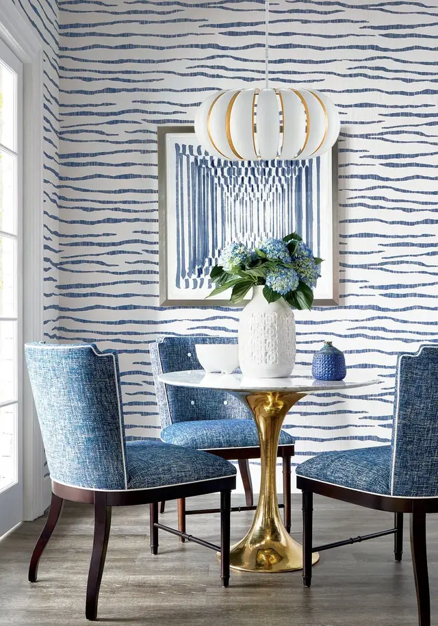 Blue zebra print wallpaper in an elegant dining room by Thibaut