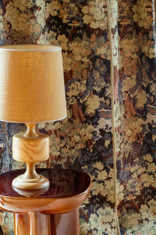 Textured botanical jacquard curtain fabric in brown, green and neutral tones
