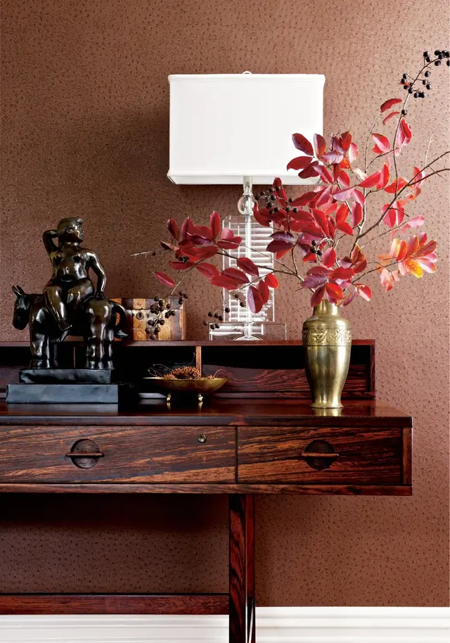 Brown ostrich-effect textured animal print wallpaper in an elegant interior by Thibaut