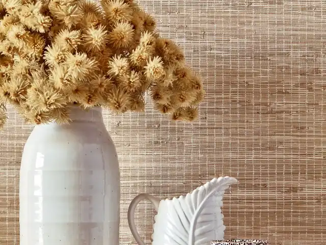 Light brown woven wallcovering showing striped natural texture