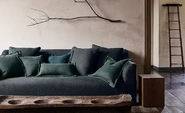Dark textured chenille upholstery on a sofa with coordinating cushions