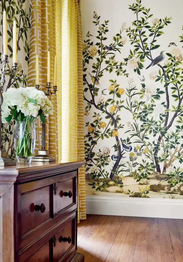 White Chinoiserie mural panels with leafy branches and birds in an elegant furnished room