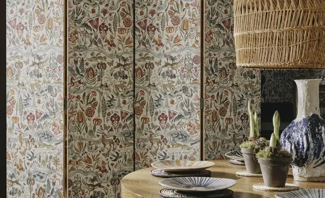Patterned Christopher Farr Cloth screens within a layered interior scheme