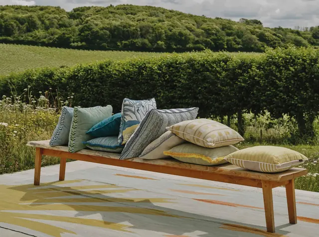 Christopher Farr Cloth performance fabrics and cushions in an outdoor setting