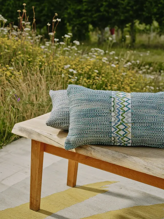Christopher Farr Cloth cushion finished with decorative woven trim