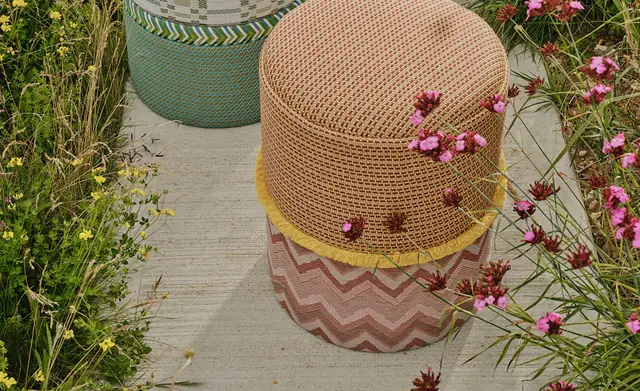 Colourful Christopher Farr Cloth borders and fringe used on upholstered stools