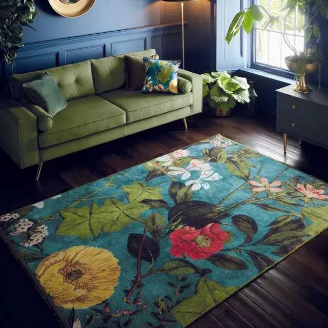 Clarke and Clarke Passiflora floral rug in a dark blue living room