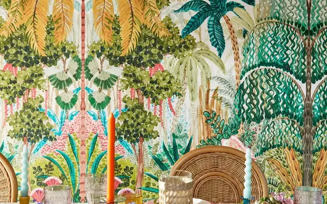 Clarke and Clarke colourful tropical wallpaper in a dining interior