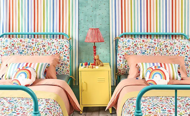 Colourful twin children's bedroom with striped, rainbow and patterned fabrics