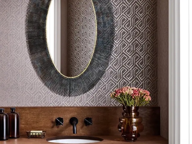 Dark luxury wallpaper creating a dramatic bathroom interior