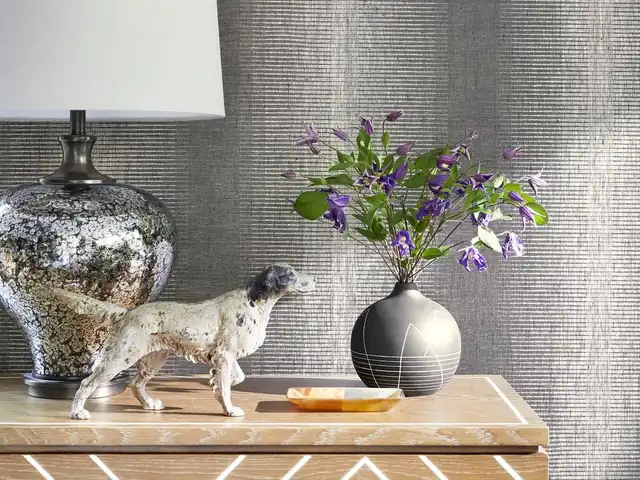 Deep silver and charcoal textured wallpaper in a contemporary interior