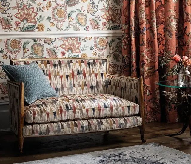 Decorative cut velvet used on an upholstered sofa in a layered interior