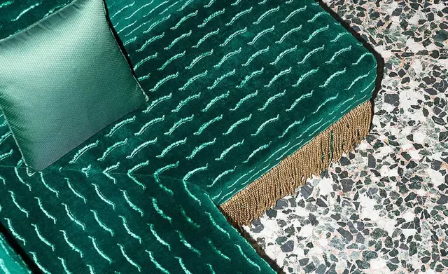 Emerald Dedar velvet used on a fringed upholstered sofa