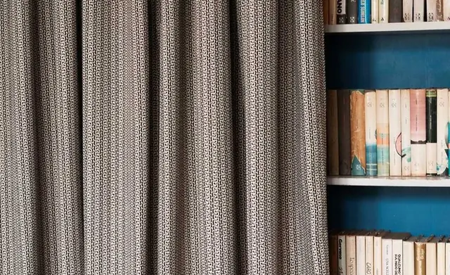 Textural Dedar Millicent fabric shown in deep tailored folds