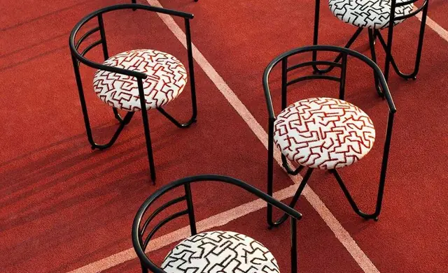 Dedar graphic upholstery fabric on sculptural metal chairs
