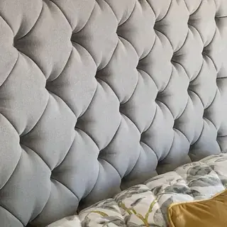 Deep buttoned upholstered headboard finish