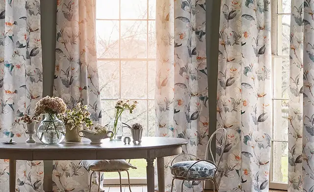 Light floral curtain fabric with delicate leaves and blossoms