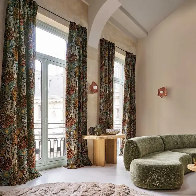 Patterned curtains and textured upholstery fabrics in a contemporary interior