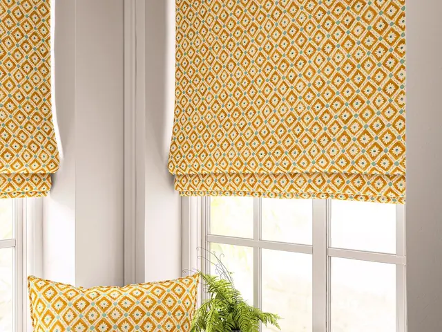 Orange geometric patterned Roman blinds showing a bold designer fabric at the window