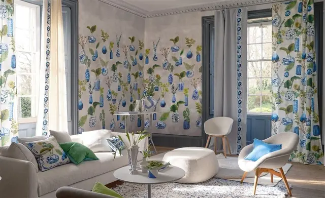 Designers Guild wallpaper, curtains, cushions and furnishings in a colourful interior