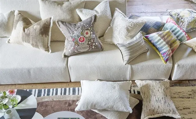 Designers Guild decorative cushions on a sofa