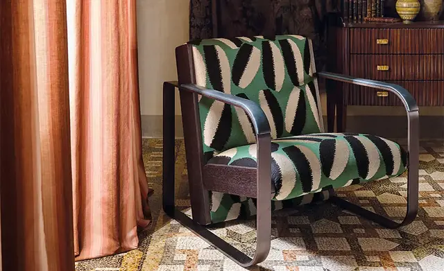 Contemporary embroidered fabric used on an upholstered armchair