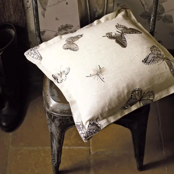 Decorative fabric with embroidered butterfly motifs