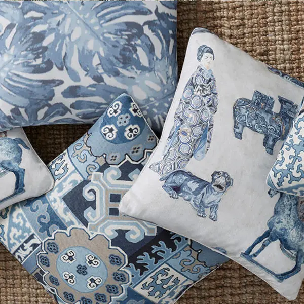 Blue and white chinoiserie fabric with decorative figurative and botanical motifs