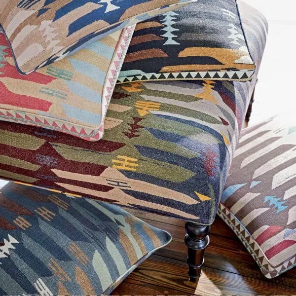 Kilim-inspired upholstery fabric with colourful angular geometric forms