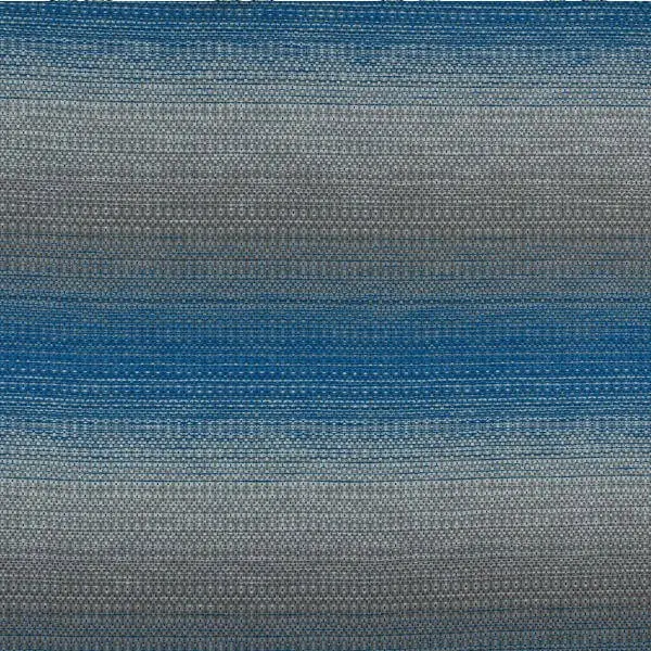 Ombre fabric gradually shading from pale grey through blue to darker tones